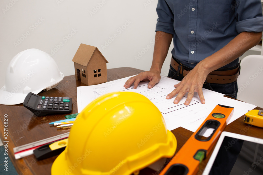 Engineers are working with architects to agree on a residential construction project.concept Engineers are working with architects to agree on a residential construction project.concept