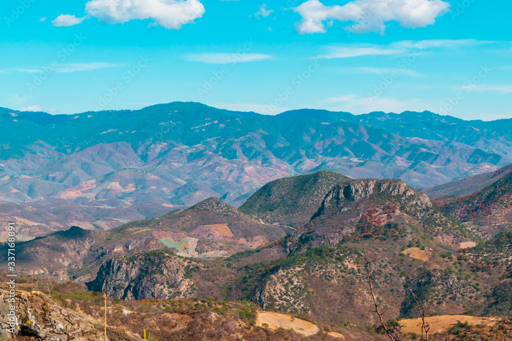 Panoramic view of mountains on blue sky