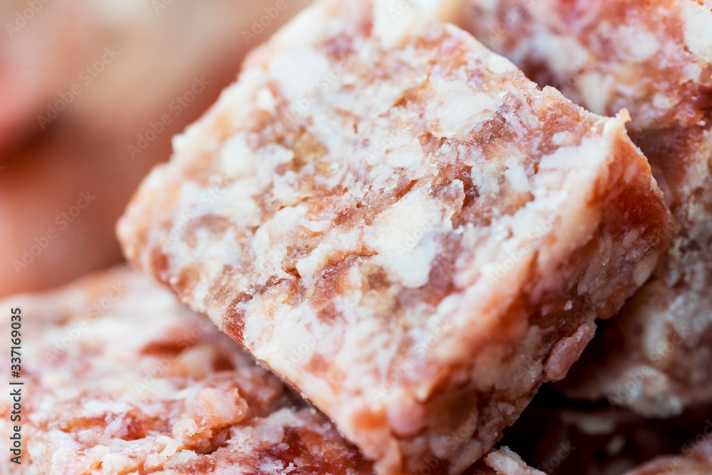 Closeup of frozen beef cube steak texture