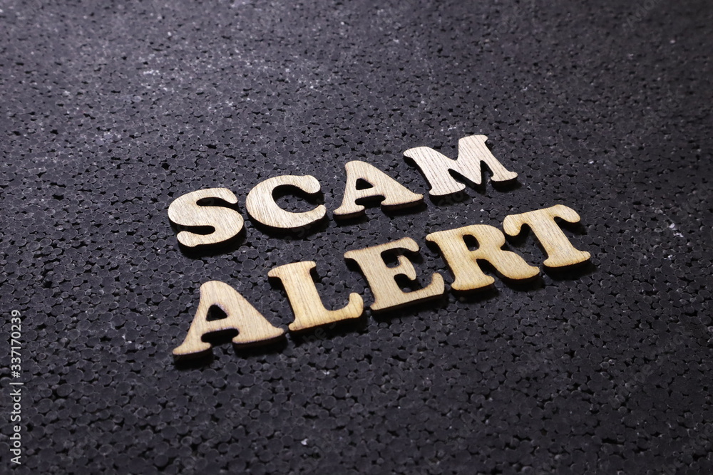 Scam Alert, Internet Fraudulent quotes, words typography top view lettering concept Scam Alert, Internet Fraudulent quotes, words typography top view lettering concept