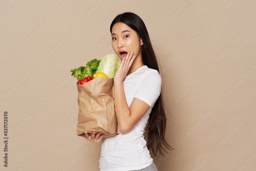 young woman holding a bunch of flowers young woman holding a bunch of flowers