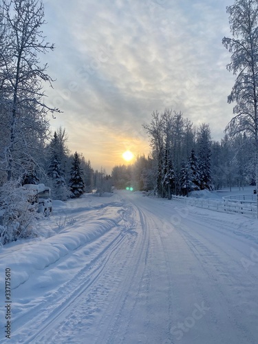 road in winter with sunset