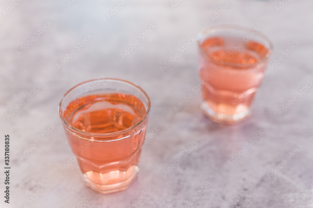 two glasses with non-alcoholic pink lemon lime bitter drink two glasses with non-alcoholic pink lemon lime bitter drink