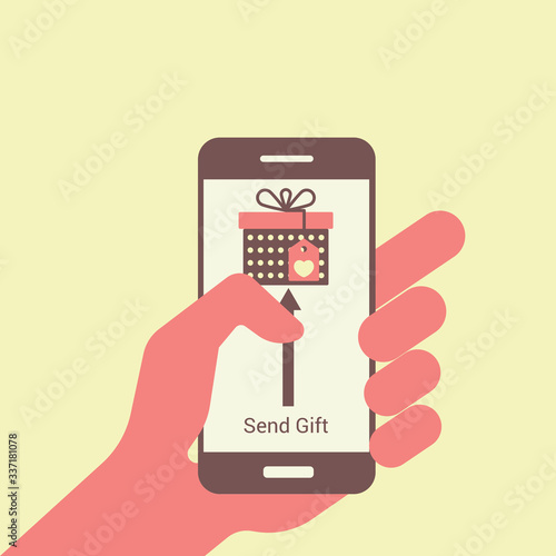 Gift box in smartphone screen. Hand hold smartphone