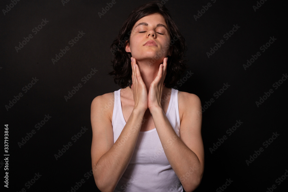 Young woman with closed eyes threws back head touching neck. Meditation concept Young woman with closed eyes threws back head touching neck. Meditation concept