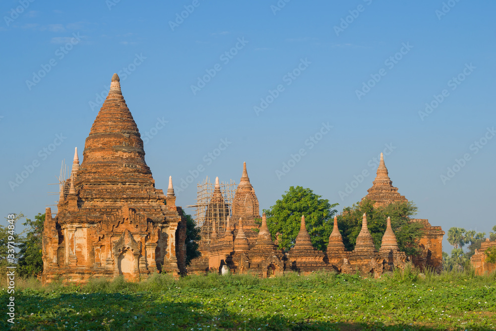 View of the ancient Buddhist temple complex on a sunny morning. Bagan, Myanmar (Burma) View of the ancient Buddhist temple complex on a sunny morning. Bagan, Myanmar (Burma)