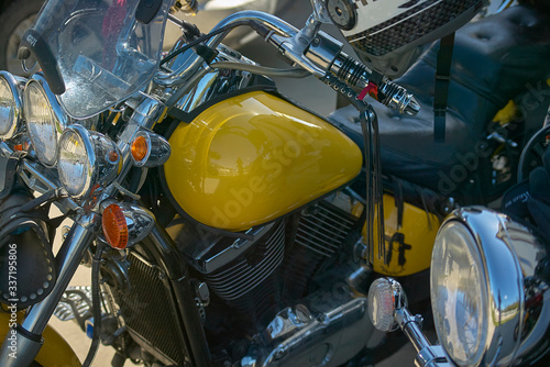 A yellow custom bike to a rally. photo