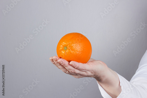 Hand with orange