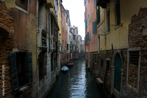 Canal Amidst Residential Buildings Against Sky © massimo russo/EyeEm