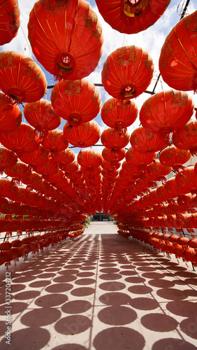 The arch is decorated with many red lanterns.