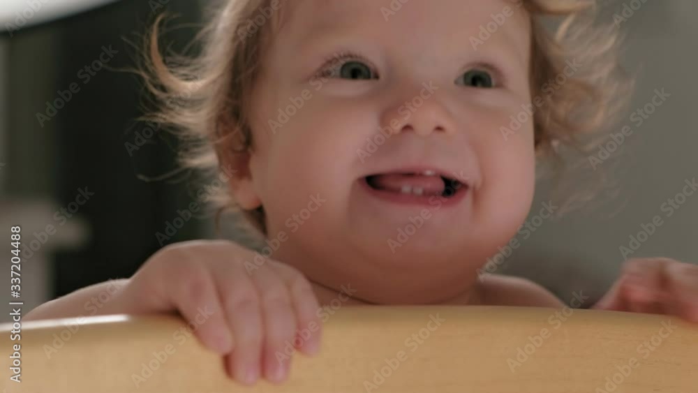 Little toddler girl with big eyes is laughing. Little toddler girl with big eyes is laughing.