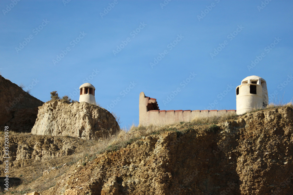 Troglodyte cave houses carved in tuff rocks of Guadix spain 