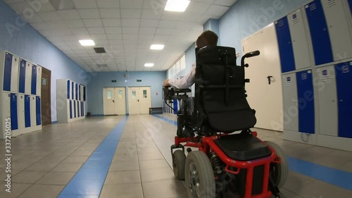 A disabled student in a wheelchair in primary school.