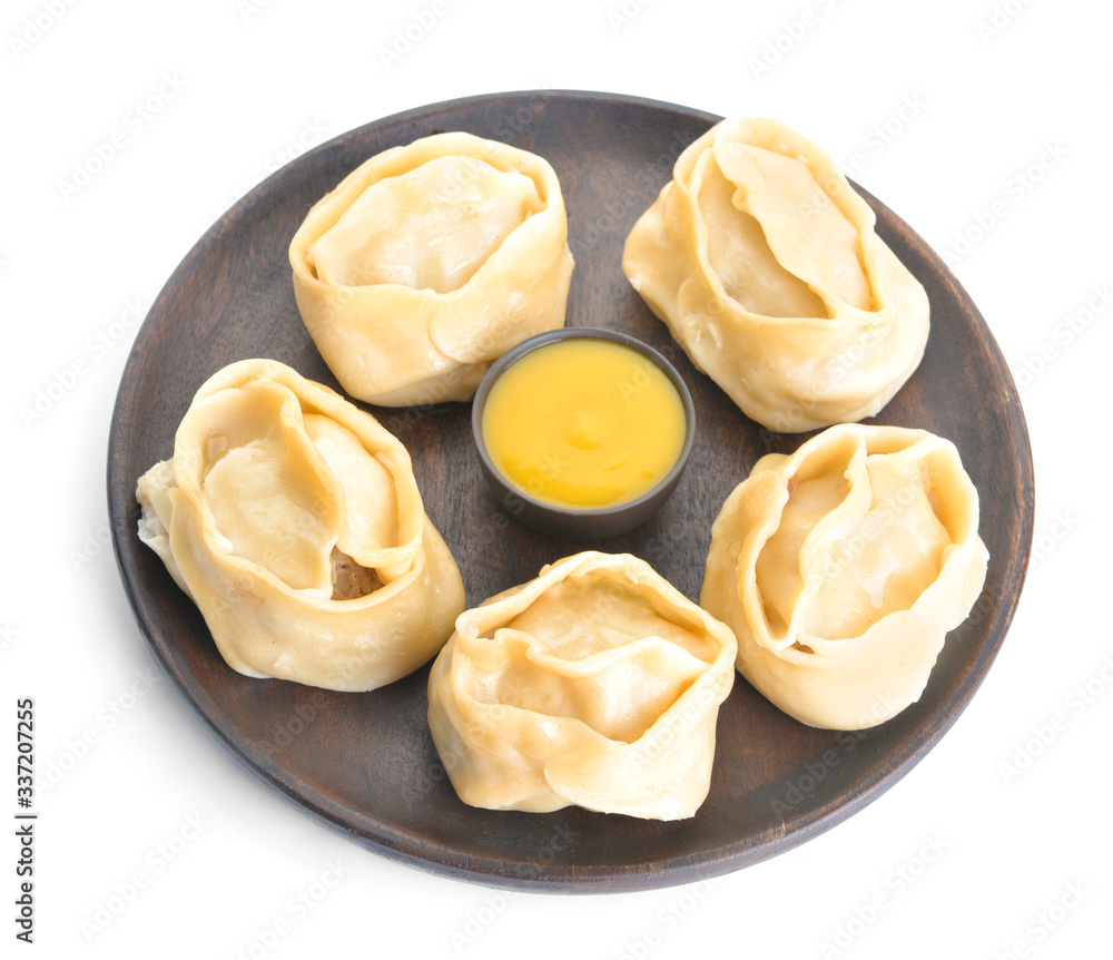 Plate with oriental dumplings and sauce on white background Plate with oriental dumplings and sauce on white background