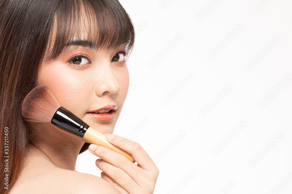 Beauty asian woman brown hair looking smile in camera happiness and hold make up brush and cheerful with make up brush,Beauty Concept on white background. Beauty asian woman brown hair looking smile in camera happiness and hold make up brush and cheerful with make up brush,Beauty Concept on white background.