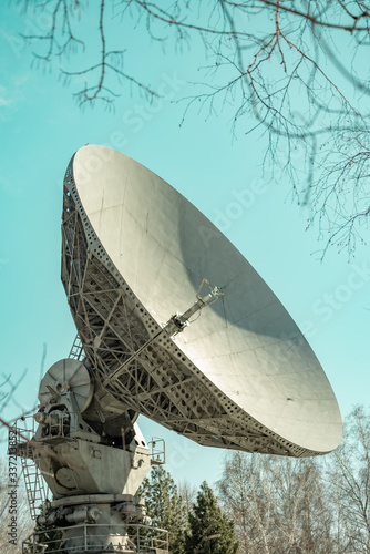 Satellite dish transmission data on blue background