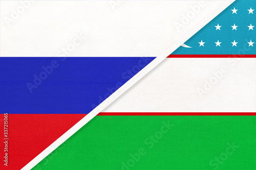 Russia vs Uzbekistan national flag from textile. Relationship and partnership between two countries. © nikol85