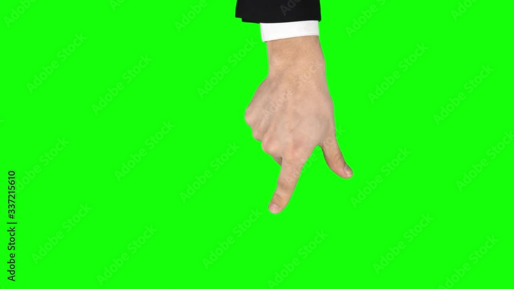 Man hand in black jacket and white shirt is performing Spread and pinch at tablet screen gesture on greenscreen. Closeup Man hand in black jacket and white shirt is performing Spread and pinch at tablet screen gesture on greenscreen. Closeup
