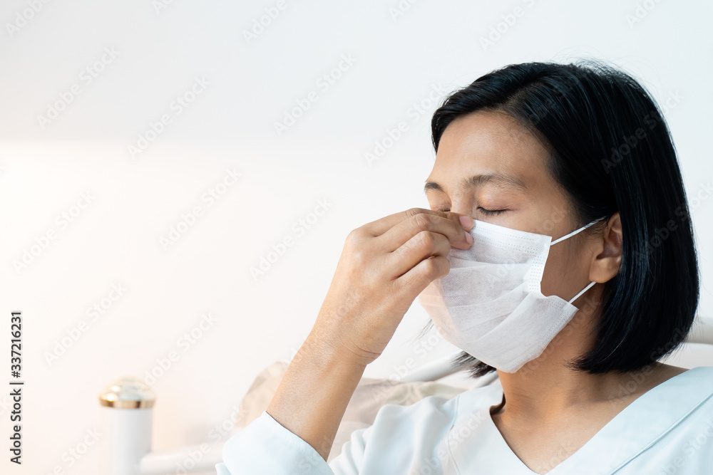 Woman under face mask covering mouth and nose. Corona Virus or COVID-19 concept. Woman under face mask covering mouth and nose. Corona Virus or COVID-19 concept.