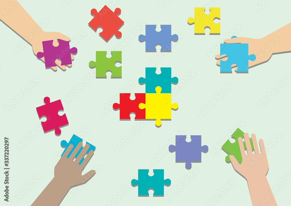 Concept of teamwork and integration with businessman holding colorful puzzle Concept of teamwork and integration with businessman holding colorful puzzle
