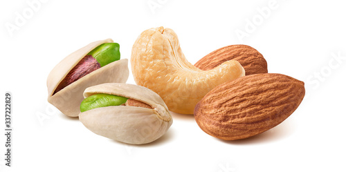 Pistachios, almonds and cashew nuts mix isolated on white background