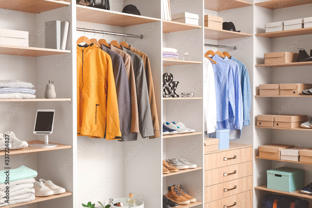 Modern wardrobe with stylish spring clothes and accessories Modern wardrobe with stylish spring clothes and accessories