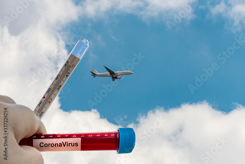 airplane flying in the sky and CoronaVirus ,  restrictions for travels