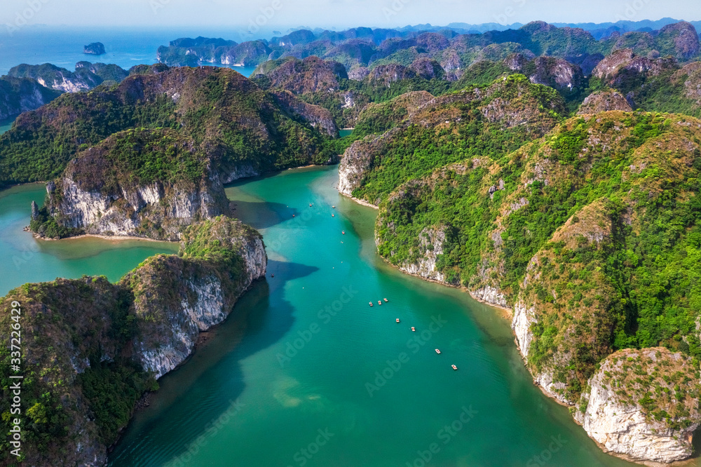 Aerial view of Sang cave and Kayaking area, Halong Bay, Vietnam, Southeast Asia. UNESCO World Heritage Site. Junk boat cruise to Ha Long Bay. Popular landmark, famous destination of Vietnam
