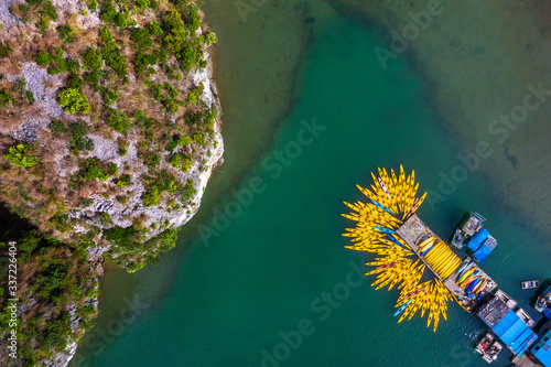 Fototapeta Naklejka Na Ścianę i Meble -  Aerial view of Sang cave and Kayaking area, Halong Bay, Vietnam, Southeast Asia. UNESCO World Heritage Site. Junk boat cruise to Ha Long Bay. Popular landmark, famous destination of Vietnam