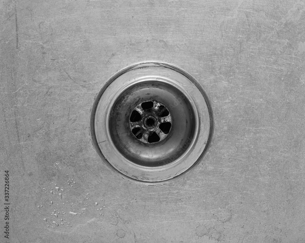 isolated steel drain for water in the kitchen sink isolated steel drain for water in the kitchen sink