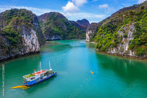 Aerial view of Sang cave and Kayaking area, Halong Bay, Vietnam, Southeast Asia. UNESCO World Heritage Site. Junk boat cruise to Ha Long Bay. Popular landmark, famous destination of Vietnam © Hien Phung