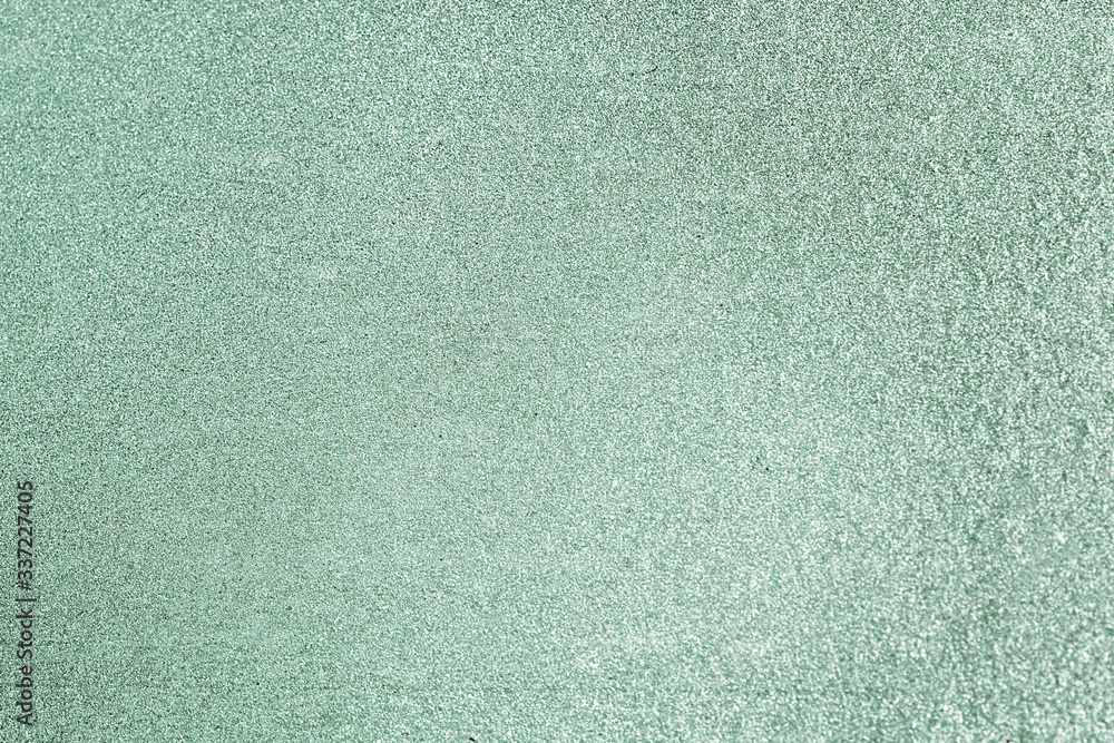 Glittery green paper background Glittery green paper background