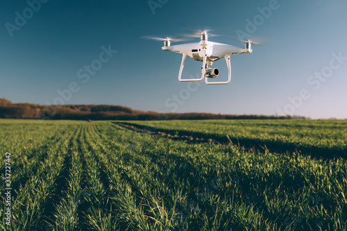 drone quad copter on green corn field photo