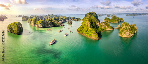 Aerial view Vung Vieng floating fishing village and rock island, Halong Bay, Vietnam, Southeast Asia. UNESCO World Heritage Site. Junk boat cruise to Ha Long Bay. Famous destination of Vietnam © Hien Phung
