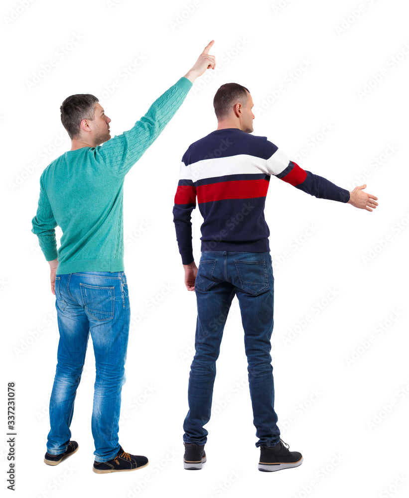 Back view of two man in sweater pointing.