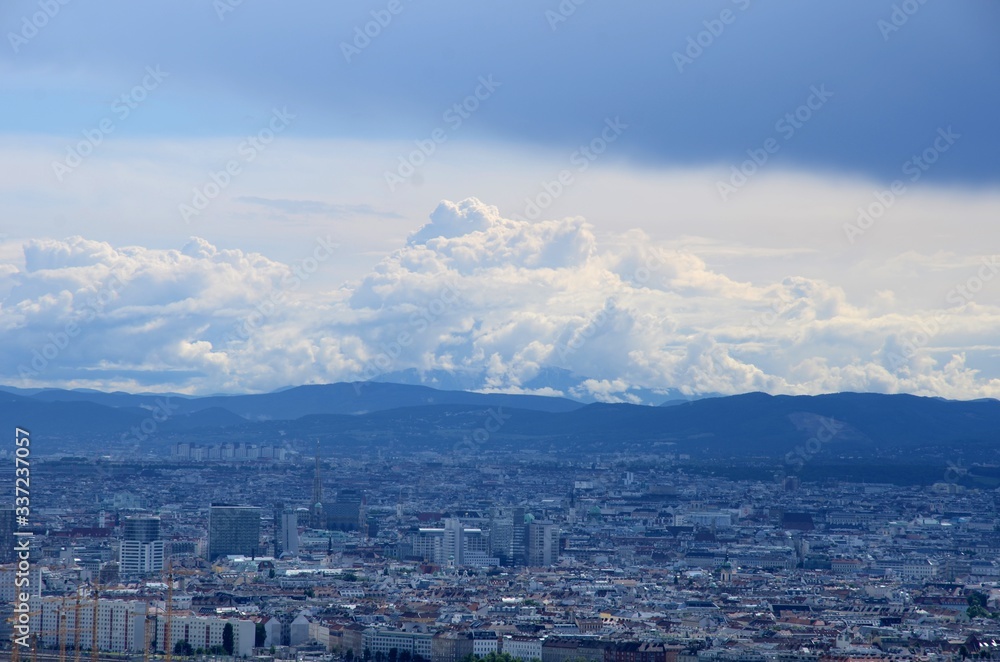 Viev of Vienna from a height of150 meters from the Danauturm over which white thunderclouds hang