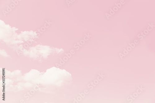 Принти на полотні Beautiful white soft fluffy clouds on a pale pink sky background