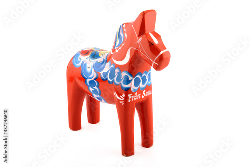 A Dalecarlian horse or Dala horse (Swedish: Dalahäst) is a traditional carved, painted wooden statue of a horse originating in the Swedish province of Dalarna (Dalecarlia).  photo