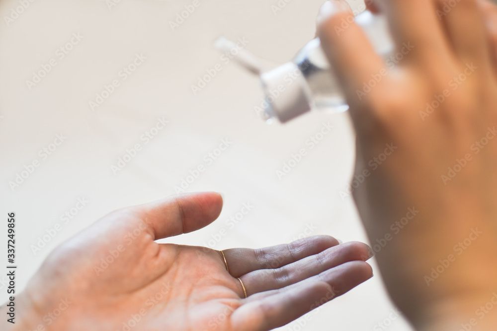 Using hand sanitizer (alcohol gel) on hand to prevent virus infection for pandemic.