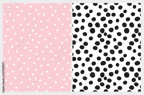 Simple Hand Drawn Irregular Dots Seamless Vector Patterns. Black Polka Dots Isolated on a White Background. White Tiny Dots on a Light Pink Layout. Infantile Style Abstract Irregular Dotted Print.