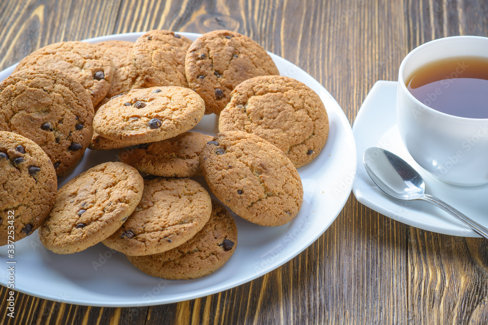 oatmeal cookies on a white dish on a wooden table oatmeal cookies on a white dish on a wooden table
