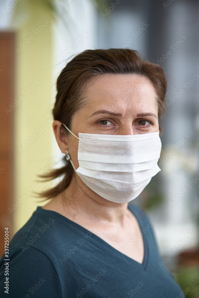 close up portrait of woman wearing surgical mask because of viruses and air pollution. Covid-19. close up portrait of woman wearing surgical mask because of viruses and air pollution. Covid-19.
