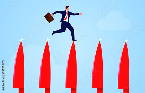 Businessman walking on the tip of the knife
