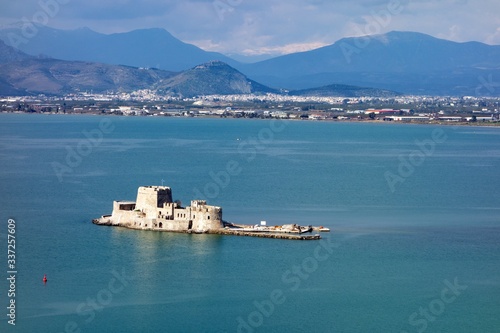 Bourtzi stone fortress in the middle of Myrtoan Sea near Naflplio town in Greece