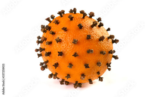 orange with cloves on a white background