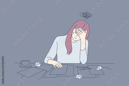 Creative crisis, fatigue, mental stress, depression, frustration concept. Young depressed frustrated upset woman or girl, writer artist has creative crisis. Fatigue, raising of mental stress, headache