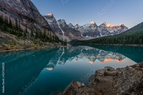 Fototapeta Naklejka Na Ścianę i Meble -  Moraine Lake is a glacier lake in Banff National Park, Canada. It lies fourteen kilometres from the village of Lake Louise in the Valley of the Ten Peaks
