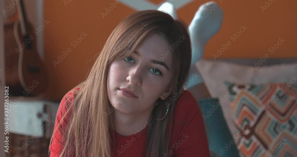 Girl sadly looking at the camera. Self-isolation stay home. Camera - Canon 5D Mark IV Girl sadly looking at the camera. Self-isolation stay home. Camera - Canon 5D Mark IV