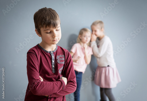 Boy feeling offended and rejected by other kids