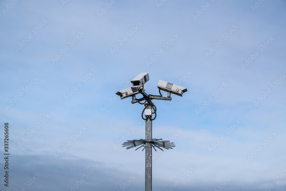 Security surveillance cameras on a post with spikes in England, UK Security surveillance cameras on a post with spikes in England, UK